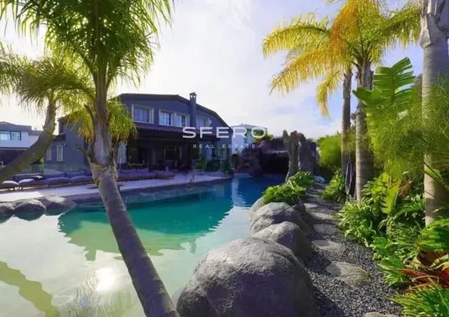 Exclusive villa with a tropical oasis-style pool in a gated community with security